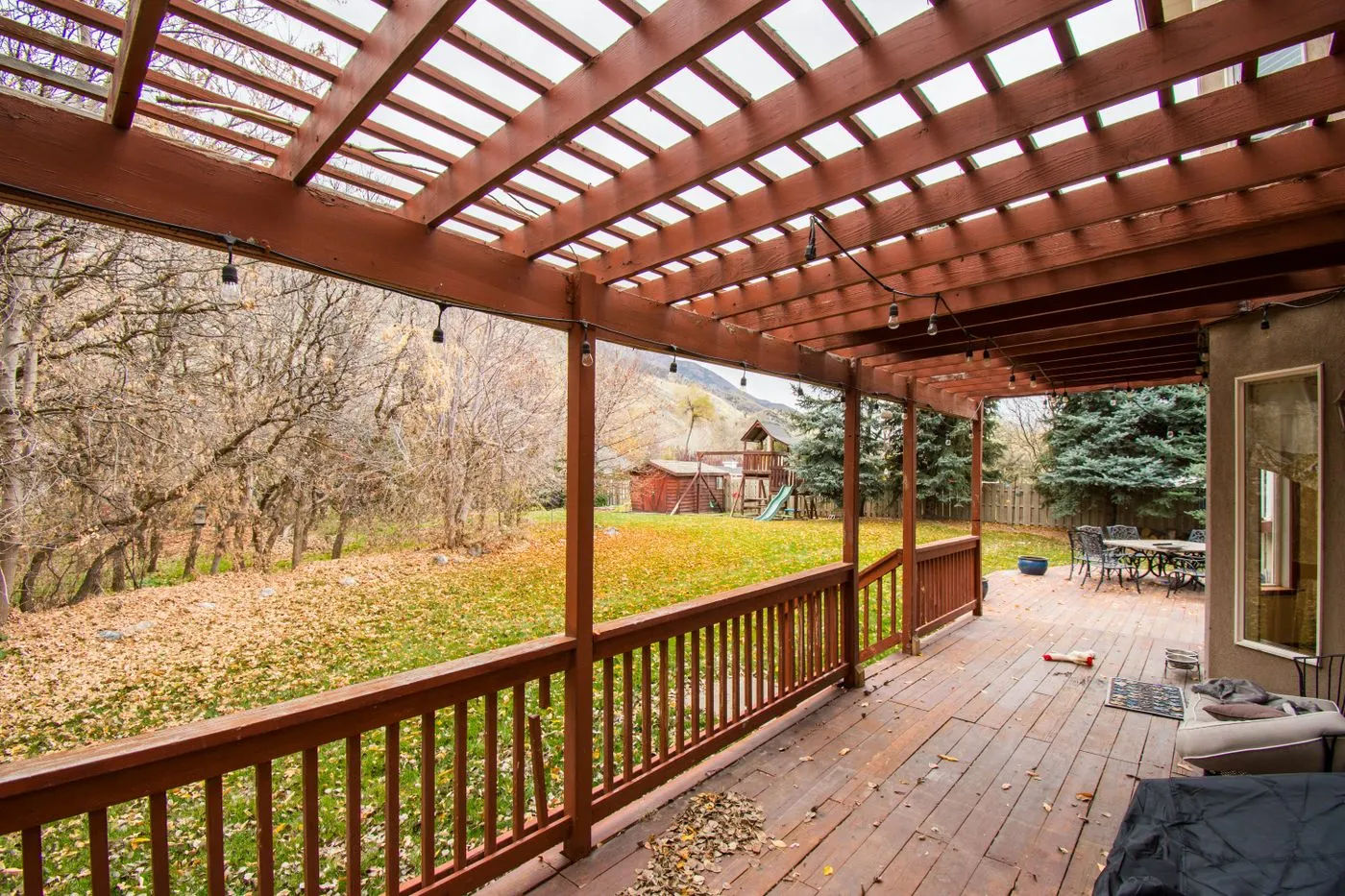 A finished backyard wood deck on a clear day